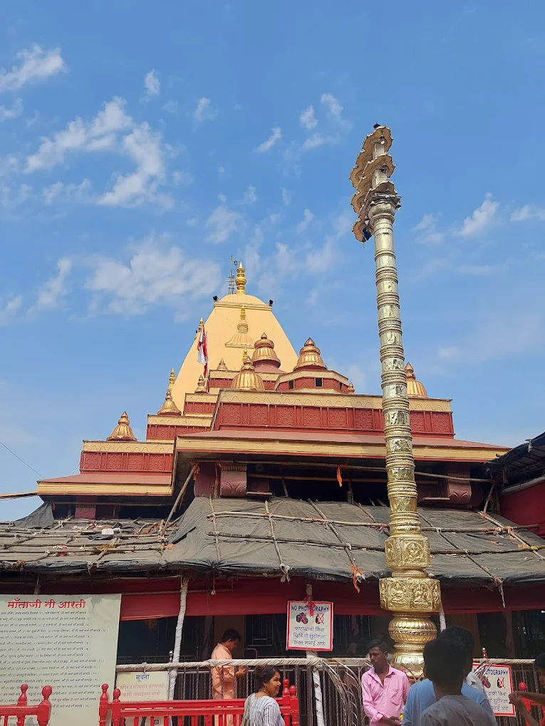 Dhwaja Stambha sacred flag pole at Shri Mahalakshmi Temple